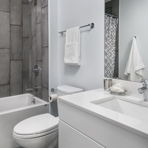 a bathroom with a tub toilet and sink
