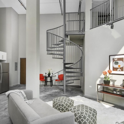 a living room with a staircase